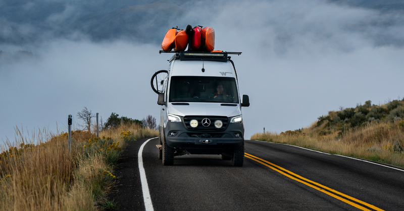 Winnebago Revel Van on a paved road